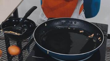 detail shot of a woman removing an egg from the frying pan with a spatula, preparing the typical colombian breakfast video