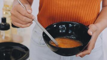 detail shot of a woman removing an egg from the frying pan with a spatula, preparing the typical colombian breakfast video