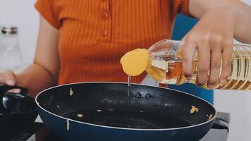 detail shot of a woman removing an egg from the frying pan with a spatula, preparing the typical colombian breakfast video