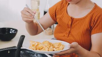 detail shot of a woman removing an egg from the frying pan with a spatula, preparing the typical colombian breakfast video
