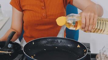 detail shot of a woman removing an egg from the frying pan with a spatula, preparing the typical colombian breakfast video