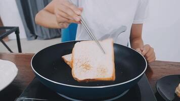detail shot of a woman removing an egg from the frying pan with a spatula, preparing the typical colombian breakfast video