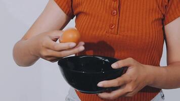 detail shot of a woman removing an egg from the frying pan with a spatula, preparing the typical colombian breakfast video