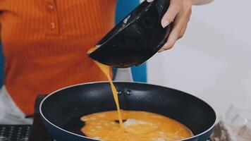 detail shot of a woman removing an egg from the frying pan with a spatula, preparing the typical colombian breakfast video
