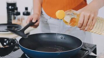 detail shot of a woman removing an egg from the frying pan with a spatula, preparing the typical colombian breakfast video