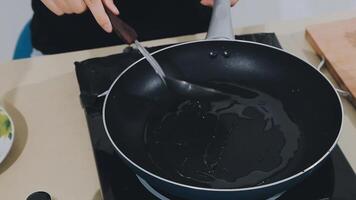 detail shot of a woman removing an egg from the frying pan with a spatula, preparing the typical colombian breakfast video
