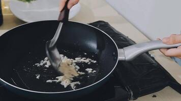 detail shot of a woman removing an egg from the frying pan with a spatula, preparing the typical colombian breakfast video