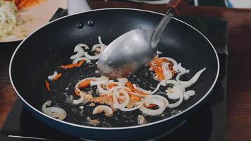 detail shot of a woman removing an egg from the frying pan with a spatula, preparing the typical colombian breakfast video