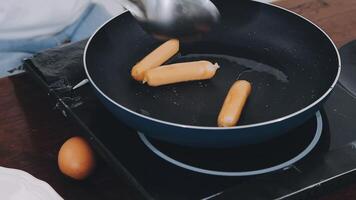 Detail of female hands adding salami on a sandwich woman making hot sandwiches for breakfast in a sandwich maker video
