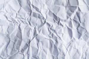 A sheet of white blank crumpled paper as background, texture photo