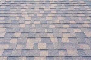 Perspective view on a shingles on the roof photo