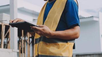 Construction worker, tablet and portrait of man with research and digital data for solar panel installation. Happy, engineer and male contractor with eco and energy project with tech and online plan video