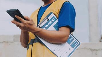 Construction worker, tablet and portrait of man with research and digital data for solar panel installation. Happy, engineer and male contractor with eco and energy project with tech and online plan video