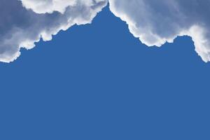 Framing on top from the fluffy clouds with highlighted edges in the blue sky with copy space photo