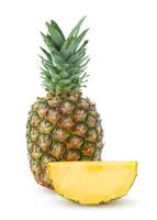 Whole ananas and slice isolated on a white background photo