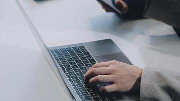 Young Asian businesswoman and businessman discuss investment project working and planning strategy on digital tablet. Business people talking together with tablet at office. video