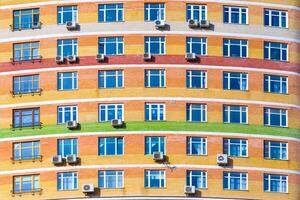 Facade of a modern residential building with air conditioning as background, texture photo