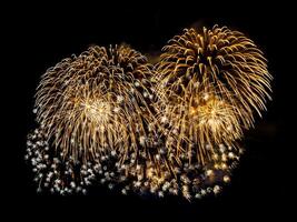 Beautiful golden fireworks on dark sky background. photo