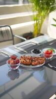Delightful breakfast spread with donuts, fruits, and berries in an outdoor setting video