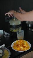 To start your day fresh, make yourself some homemade orange juice using a juicer in your own kitchen video