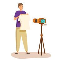Fashion blogger presenting a t shirt using a camera on a tripod vector
