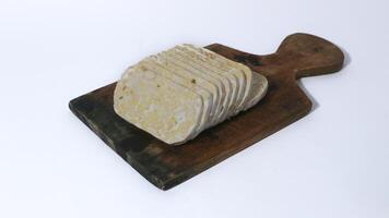 Raw tempe wrapped in banana leaves, Indonesian traditional food, create from soybean photo