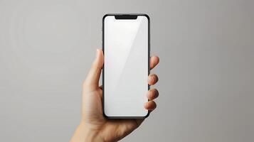 Hand holding smartphone with blank screen mockup photo