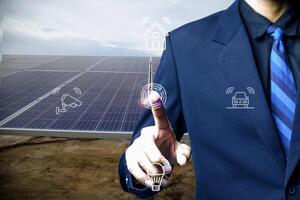 A man tracks energy production from a solar power plant with a mobile phone. Close-up of a phone screen with a program running. Remotely controlled storage of solar energy production. photo