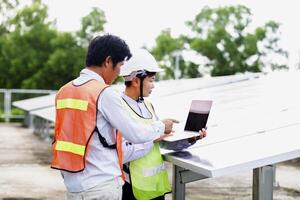 Female electrical engineering team and worker seller install solar photovoltaic panels Clean and environmentally friendly alternative energy Unity and teamwork. photo