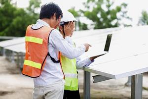 Female electrical engineering team and worker seller install solar photovoltaic panels Clean and environmentally friendly alternative energy Unity and teamwork. photo