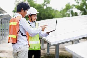 Female electrical engineering team and worker seller install solar photovoltaic panels Clean and environmentally friendly alternative energy Unity and teamwork. photo