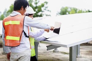 Female electrical engineering team and worker seller install solar photovoltaic panels Clean and environmentally friendly alternative energy Unity and teamwork. photo