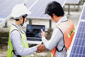 Female electrical engineering team and worker seller install solar photovoltaic panels Clean and environmentally friendly alternative energy Unity and teamwork. photo