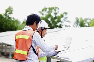 Female electrical engineering team and worker seller install solar photovoltaic panels Clean and environmentally friendly alternative energy Unity and teamwork. photo