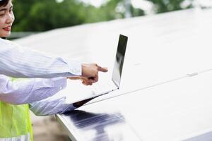Female electrical engineering team and worker seller install solar photovoltaic panels Clean and environmentally friendly alternative energy Unity and teamwork. photo