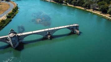 Broken bridge Saint-Benezet in the city of Avignon in Provence. famous Avignon bridge over the Rhone depicted in paintings, poems, stamps. architecture seen from a drone with its arches. photo