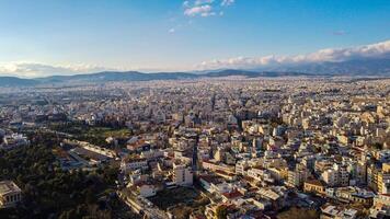 Aerial view of the magnificent city of Athens, capital of Greece. Overpopulation of the metropolis that attracts tourists. High density of populations with clustered houses. Very busy tourist spot photo