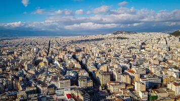 Aerial view of the magnificent city of Athens, capital of Greece. Overpopulation of the metropolis that attracts tourists. High density of populations with clustered houses. Very busy tourist spot photo
