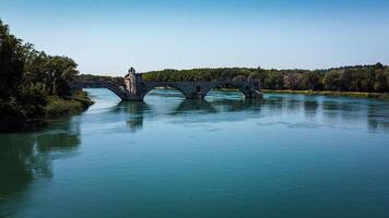 Broken bridge Saint-Benezet in the city of Avignon in Provence. famous Avignon bridge over the Rhone depicted in paintings, poems, stamps. architecture seen from a drone with its arches. photo