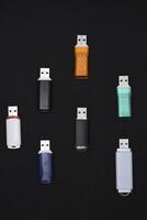 USB flash drives on a black background. The information carrier. Several flash drives. photo