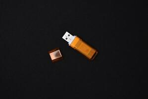 USB flash drives on a black background. The information carrier. Several flash drives. photo