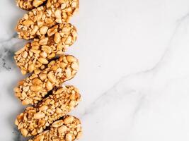 Healthy eclairs wit peanuts, copy space right photo