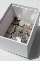 Ukrainian Coins Of Variety Denominations In Clean White Box On White Surface photo