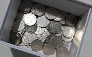 Heap Of Ukrainian Money In Coins At The Bottom Of White Box Closeup View Stock Photo