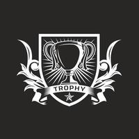 Trophy cup standing on shield with banner and floral ornaments vector