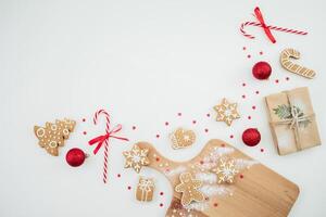Christmas decoration with gifts, confetti and cookies. Flat lay, top view. New Year concept with copy space photo