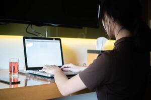 work from home, Over-the-Shoulder View of Laptop Use photo