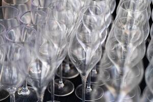 Close-up of empty wine glasses arranged in a pattern photo