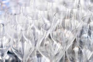 Close-up of empty wine glasses in a pattern photo