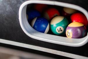 Billiard balls in pool table return system photo